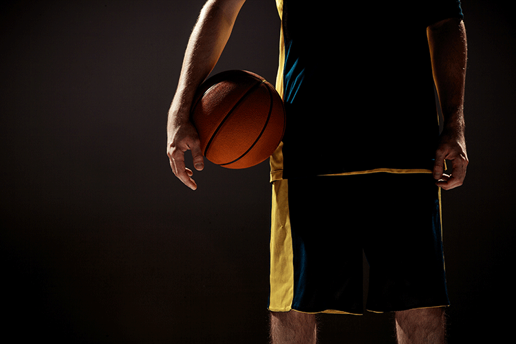 Custom basketball team uniforms - sublimated jerseys with team logos and colors